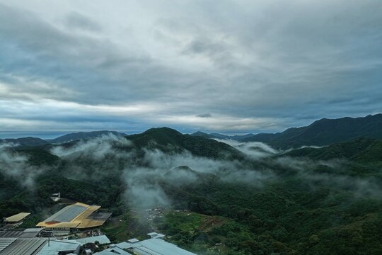 Aerial drone photo of sea of clouds over mountain valley in Mihama, Mie, Japan