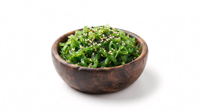 Healthy chuka wakame seaweed salad with sesame seeds in a rustic wooden bowl isolated on white background