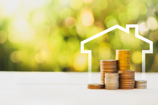 House Icon Frame with Stacked Money Coins, Mortgage and Home Loan Savings