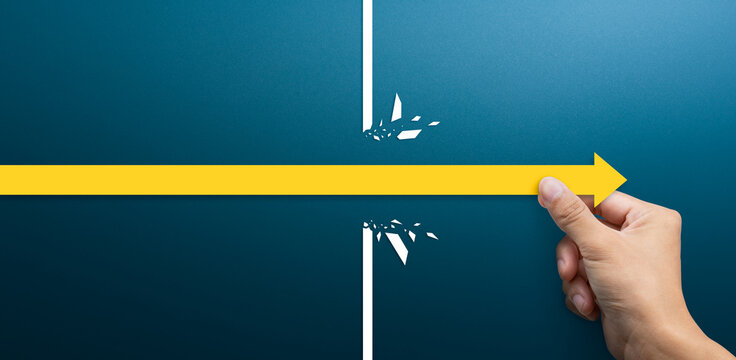 Breakthrough and Success Concept, Hand Moving Arrow Past Obstacle