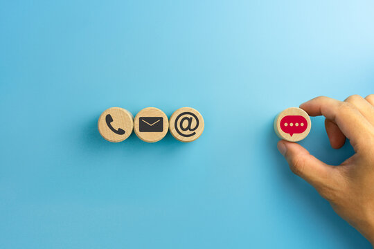 Contact Us Options Concept, Phone, Email, Address and Message Icons on Wooden Blocks