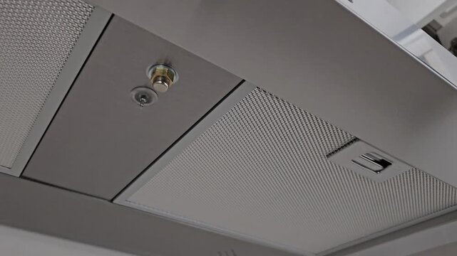A video showing a range hood installed in an apartment kitchen