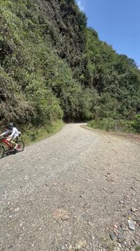 The Death road, Bolivia - July 29 2019: Downhill Mountainbiking on the famous dangerous Death Road (Camino de la Muerte), 3150 metres of descent, 64 km