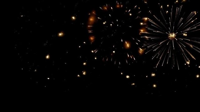 Golden firework display bursting over dark night sky with sparkling golden burst sky display
