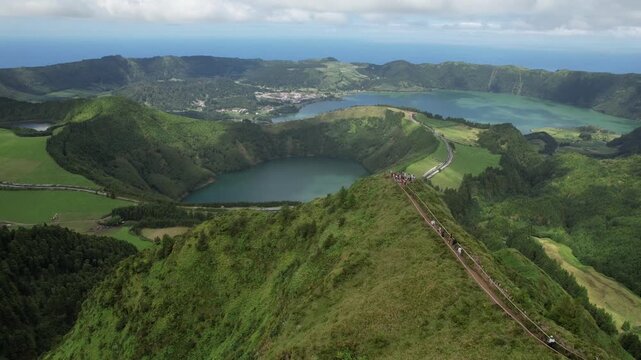 Aerial drone view of Miradouro da Grota do Inferno overlooking the volcanic lakes and lush landscape of Sete Cidades, Sao Miguel, Azores, Portugal