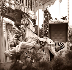 White ponies on a children's carousel © Marina
