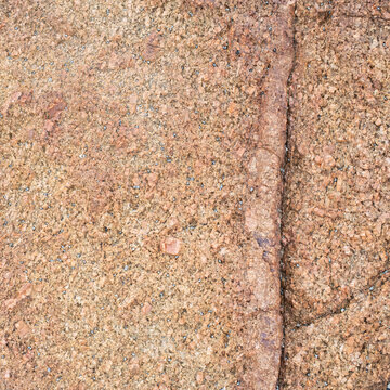 High‑resolution close‑up of a natural rock surface showing detailed texture, organic patterns, and weathered geological features. Ideal for backgrounds, design elements, and nature‑themed creative pro