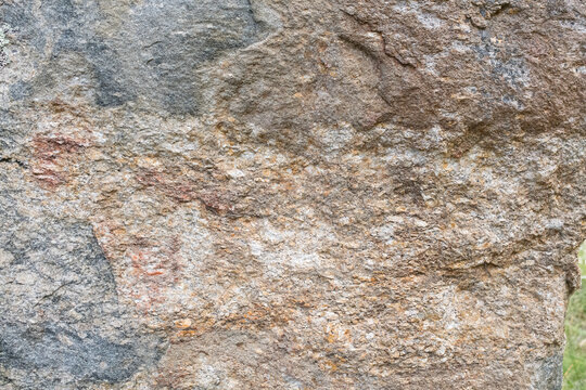 High‑resolution close‑up of a natural rock surface showing detailed texture, organic patterns, and weathered geological features. Ideal for backgrounds, design elements, and nature‑themed creative pro