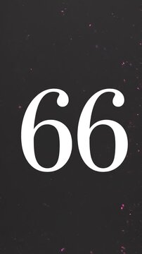 Pink Glitter Blows Away and Reveals the Number 66 on Solid Background