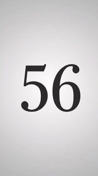 Pink Glitter Blows Away and Reveals the Number 56 on Solid Background