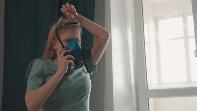 Caucasian tenant calls cleanup service. Wearing respirator then removing mask by window, dialing phone, discussing mold remediation and air quality, holding notes and evidence, anxious but proactive