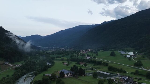 Aerial view of Spiazzo and Pelugo church at dusk in Val Rendena - Trentino Italy - drone 4k