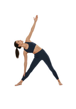 Fit woman doing triangle yoga pose on transparent background