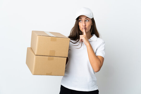 Young delivery woman over isolated white background showing a sign of silence gesture putting finger in mouth