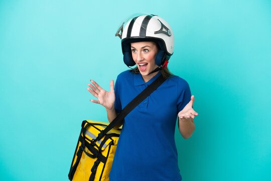 Young caucasian woman with thermal backpack isolated on white background with surprise facial expression