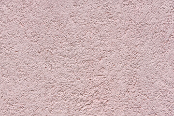 Abstract pink stucco wall texture background with a subtle rough finish and copy space © Saminda