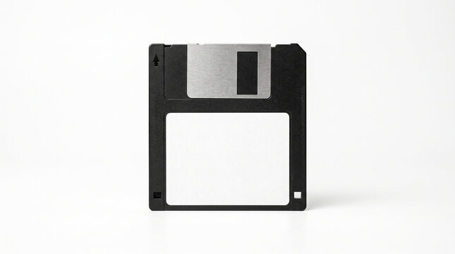 Black floppy diskette storage media isolated against clean white background for data preservation concepts with diskette metallic sliding sliding shutter centered
