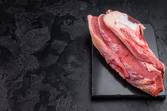 Raw beef rib cut with bone, marrow and connective tissue, perfect for simmering rich homemade broth and traditional stock.