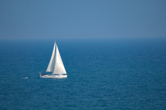 sailboat in the blue sea