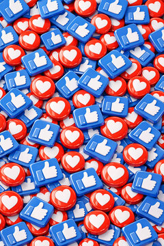 A collection of red and blue Facebook like buttons, representing social media engagement and online communication.