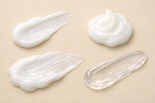 Beauty product samples on a light beige background.