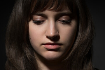 Fototapeta premium Beautiful teen girl portrait with makeup on dark background