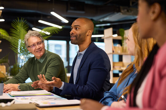 Multiethnic business people discussing at meeting table