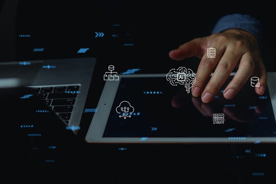 Hand using tablet with AI brain cloud computing and database server network hologram