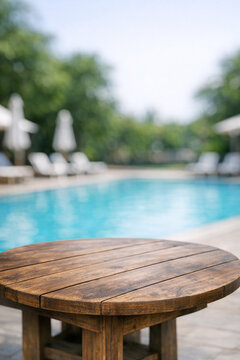 Swimming pool patio table set near water, suitable for outdoor activities and relaxation.