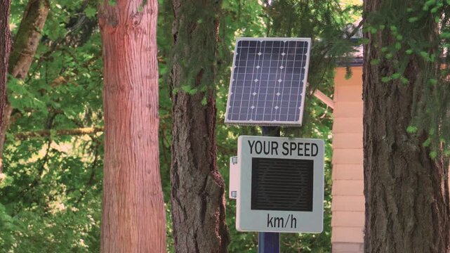 Solar powered radar speed sign 35 kmh in forest road