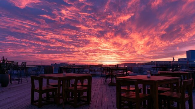 Rooftop Restaurant Dining Area with Sunset View and Vibrant Sky