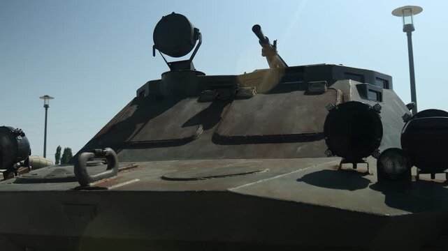 A military vehicle parked in a parking lot, perfect for use in military or government settings