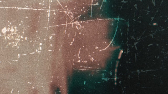 Heavily distressed film texture with overexposed highlights, bright flares, dust scratches, raw analog feel