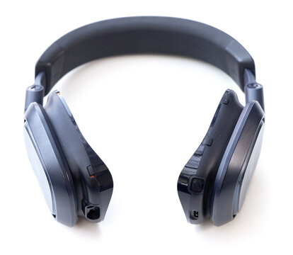 Modern wireless black headphones isolated on white background studio shot
