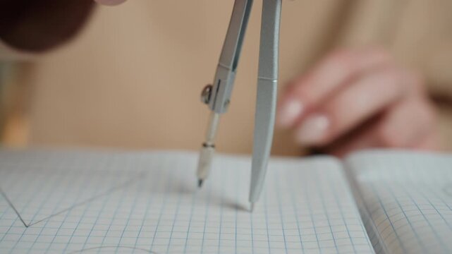Student drawing circle with compass on graph paper notebook, tutor guiding precise geometry at home desk, warm light, closeup hands measuring arcs and marking points, methodical practice and calm