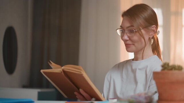 Woman proofreading manuscript at home desk, glasses and plant on tabletop, warm backlight from window, closeup of editor marking pages and taking notes, quiet focused atmosphere for revision