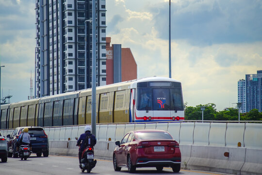 Bangkok, Thailand - June  16, 2026 : The BTS Sky Train Passing Taksin Bridge (Saphan Taksin or Saphan Sathorn) in the afternoon.