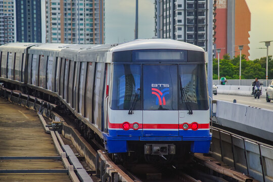 Bangkok, Thailand - June  16, 2026 : The BTS Sky Train Passing Taksin Bridge (Saphan Taksin or Saphan Sathorn) in the afternoon.