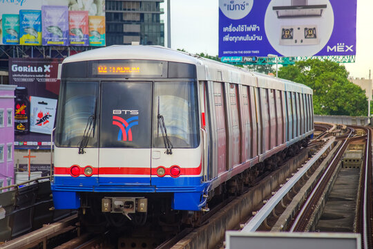 Bangkok, Thailand - June  16, 2026 : A BTS Skytrain pulling into Saphan Taksin Station in the afternoon.
