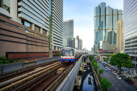 Bangkok, Thailand - June  16, 2026 : BTS Skytrain is entering Chong Nonsi Station, passing the skywalk, which is a check-in point in Bangkok, Thailand.