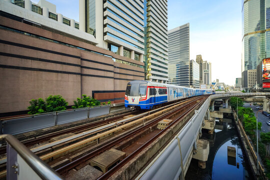 Bangkok, Thailand - June  16, 2026 : BTS Skytrain is entering Chong Nonsi Station, passing the skywalk, which is a check-in point in Bangkok, Thailand.