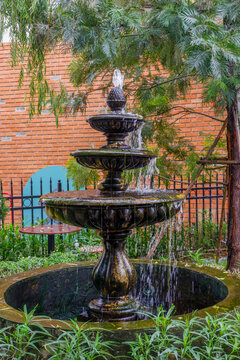 Luxury Fountain at green garden in house outdoor garden,Scenic View of a Beautiful English Style Landscape Garden in summer,selective focus.