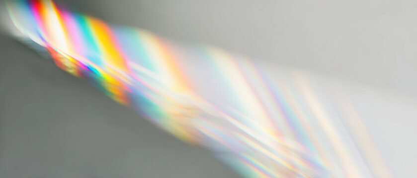 abstract prism light spectrum beams radiate from bright core over calm gray field for futuristic web design backdrops
