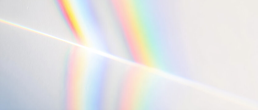abstract prism light spectrum beams radiate from bright core over calm gray field for futuristic web design backdrops
