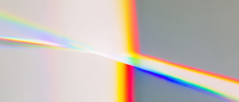 abstract prism light spectrum beams radiate from bright core over calm gray field for futuristic web design backdrops
