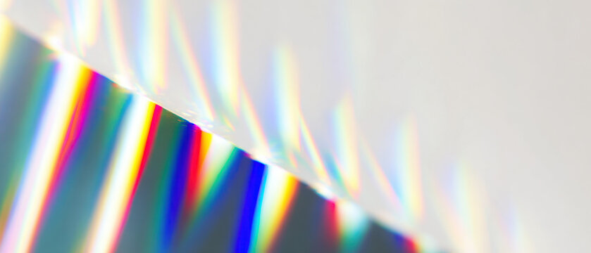 abstract prism light spectrum beams radiate from bright core over calm gray field for futuristic web design backdrops
