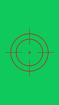 Red crosshair target overlay on green screen for chroma key compositing reticle scope