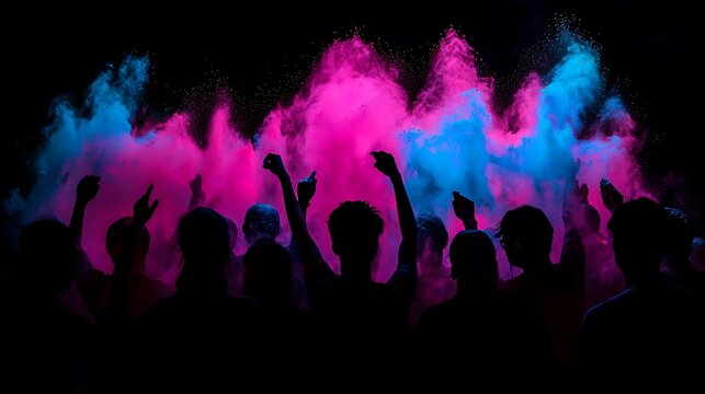 Silhouettes of people celebrating with vibrant colored powder