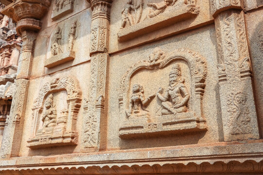 Ancient stone temple ruins and historic carved architecture in Hampi, India. Beautiful landscape with archaeological site, cultural heritage landmark and popular international tourist destination.