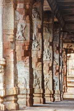 Ancient stone temple ruins and historic carved architecture in Hampi, India. Beautiful landscape with archaeological site, cultural heritage landmark and popular international tourist destination.
